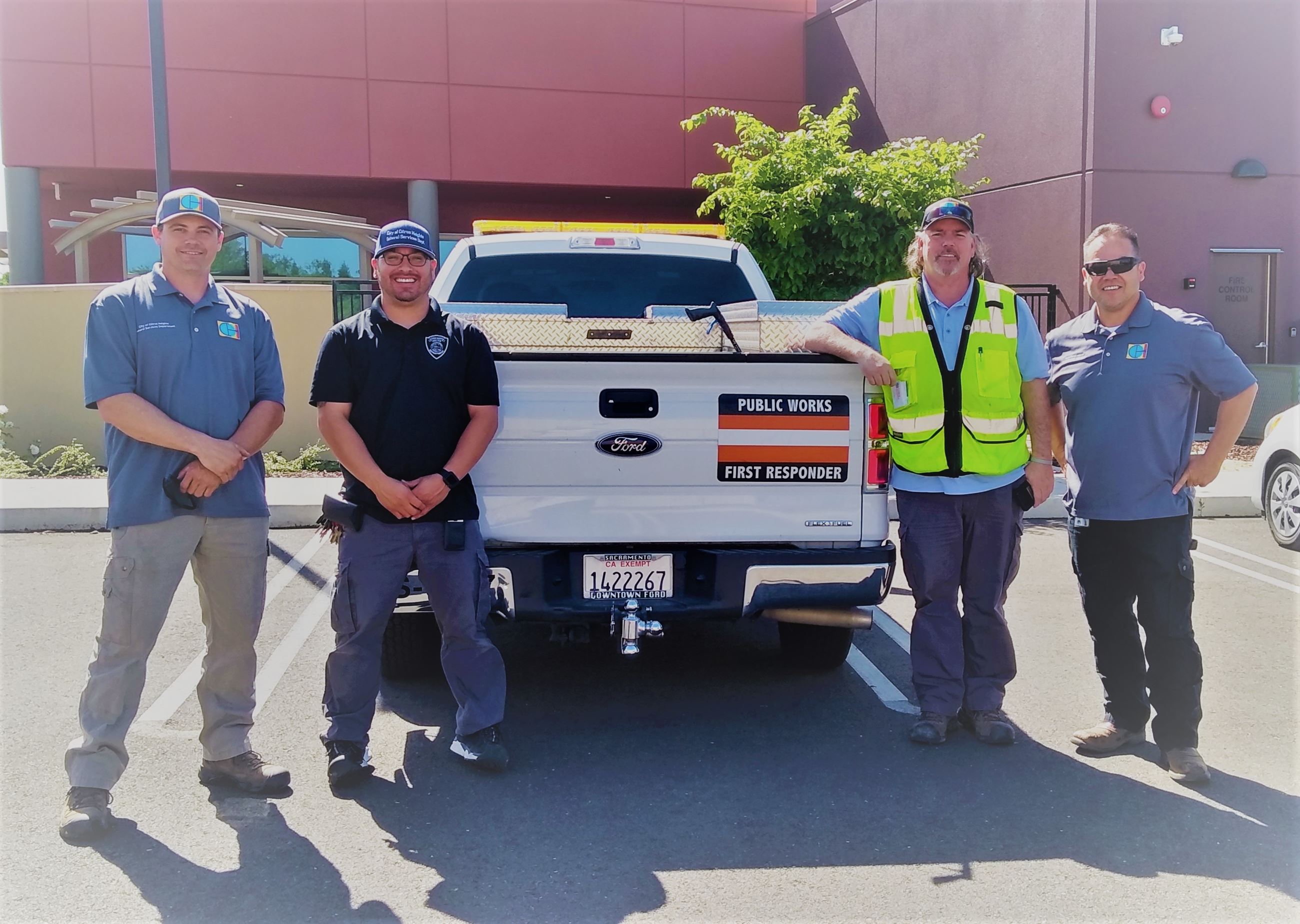 General Services Department first responders four men next to a city truck