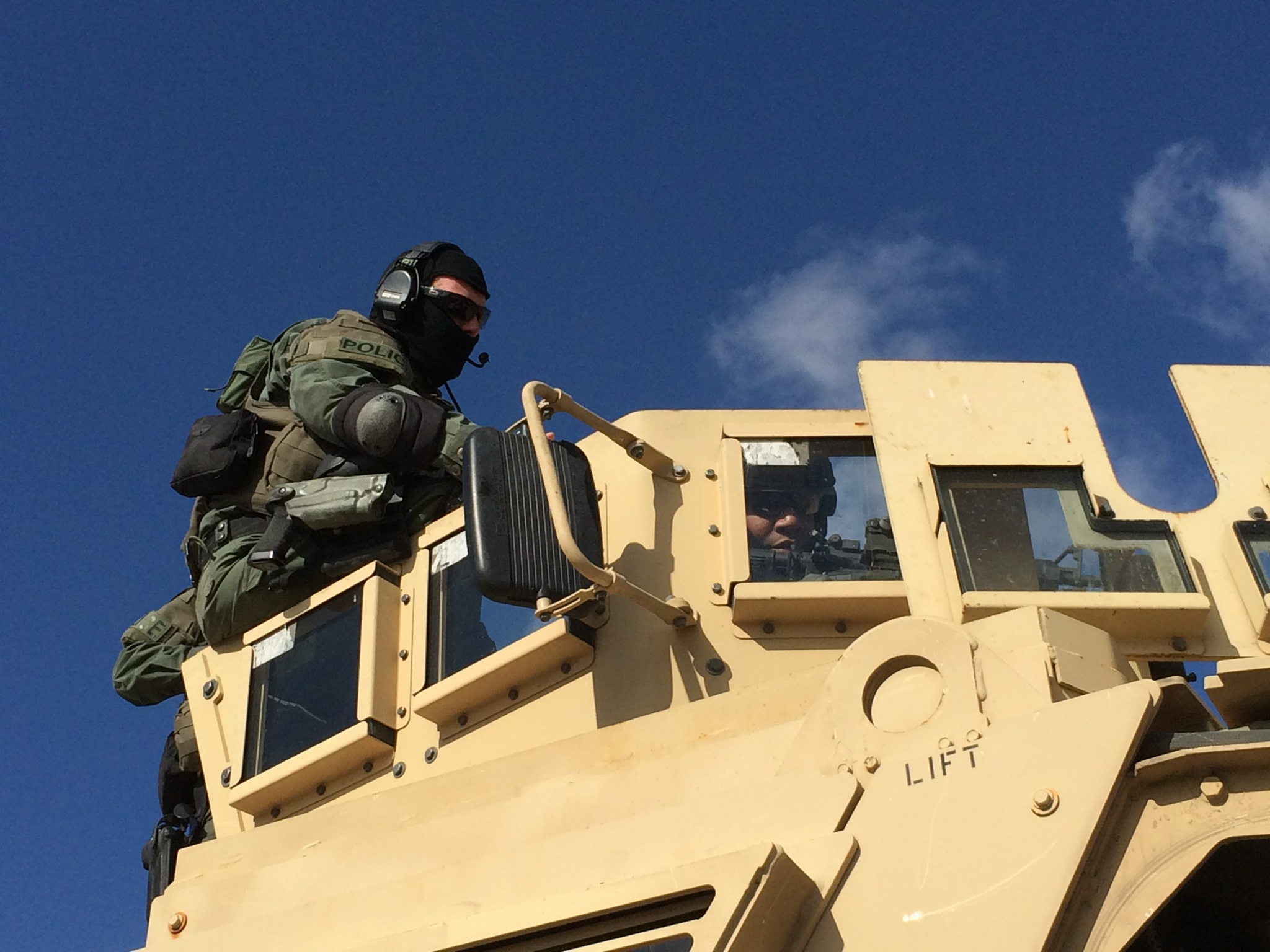 Picture of SWAT Team Members on Vehicle