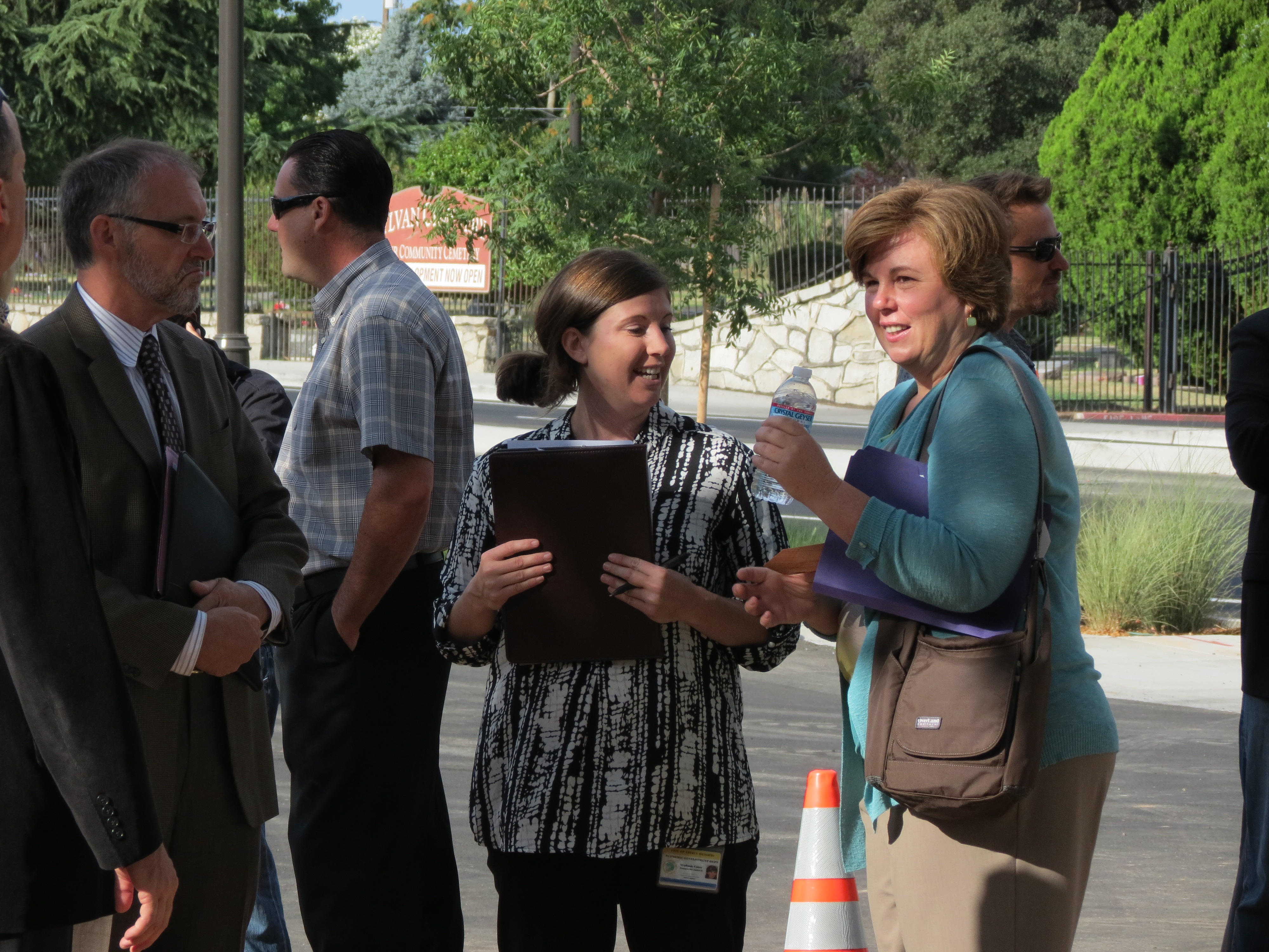 City employees discussing the event