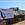 The groundbreaking shovels and hardhats lined up in front of Ascent Builders trucks