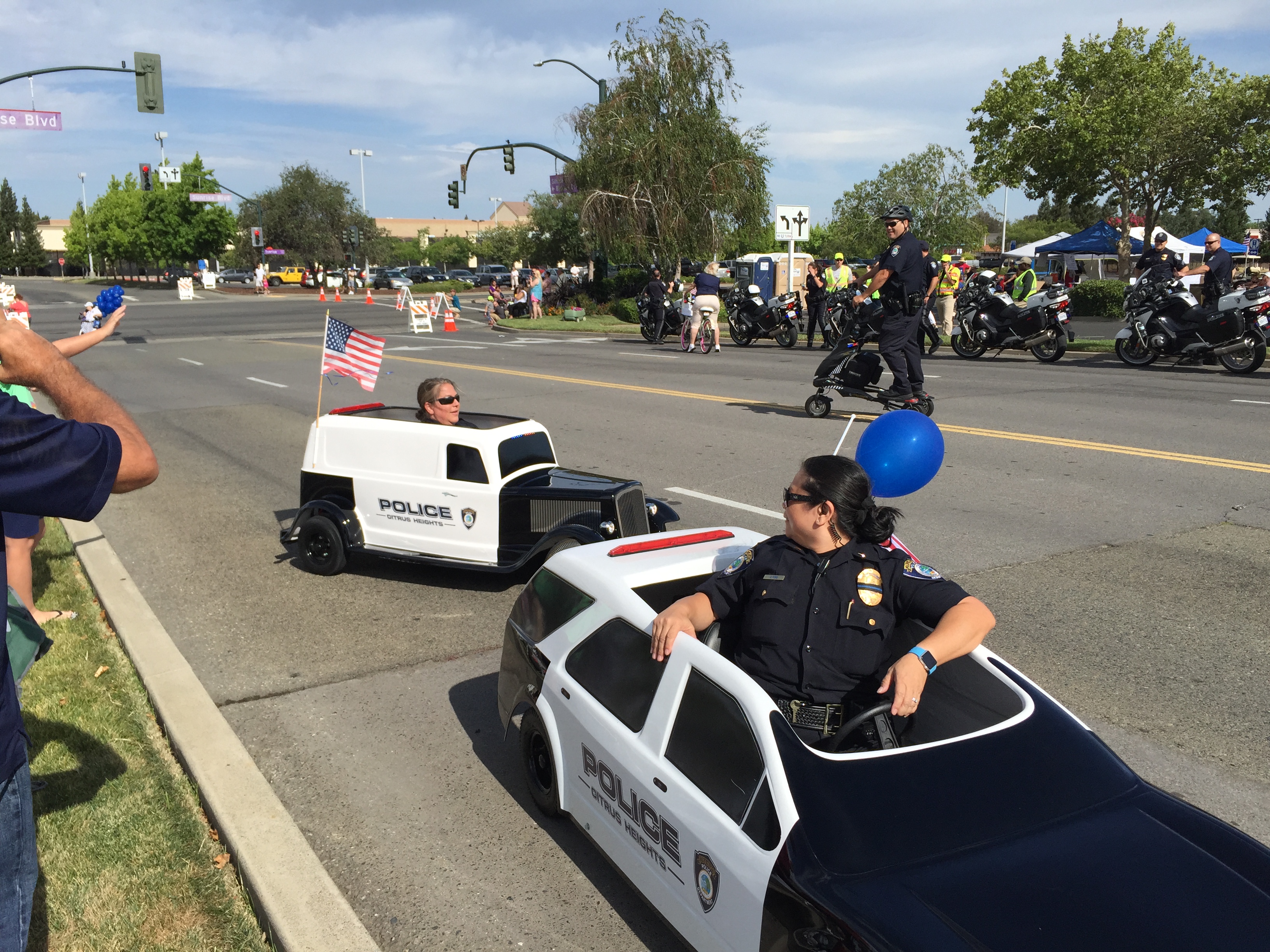 Officers having fun driving mini cars
