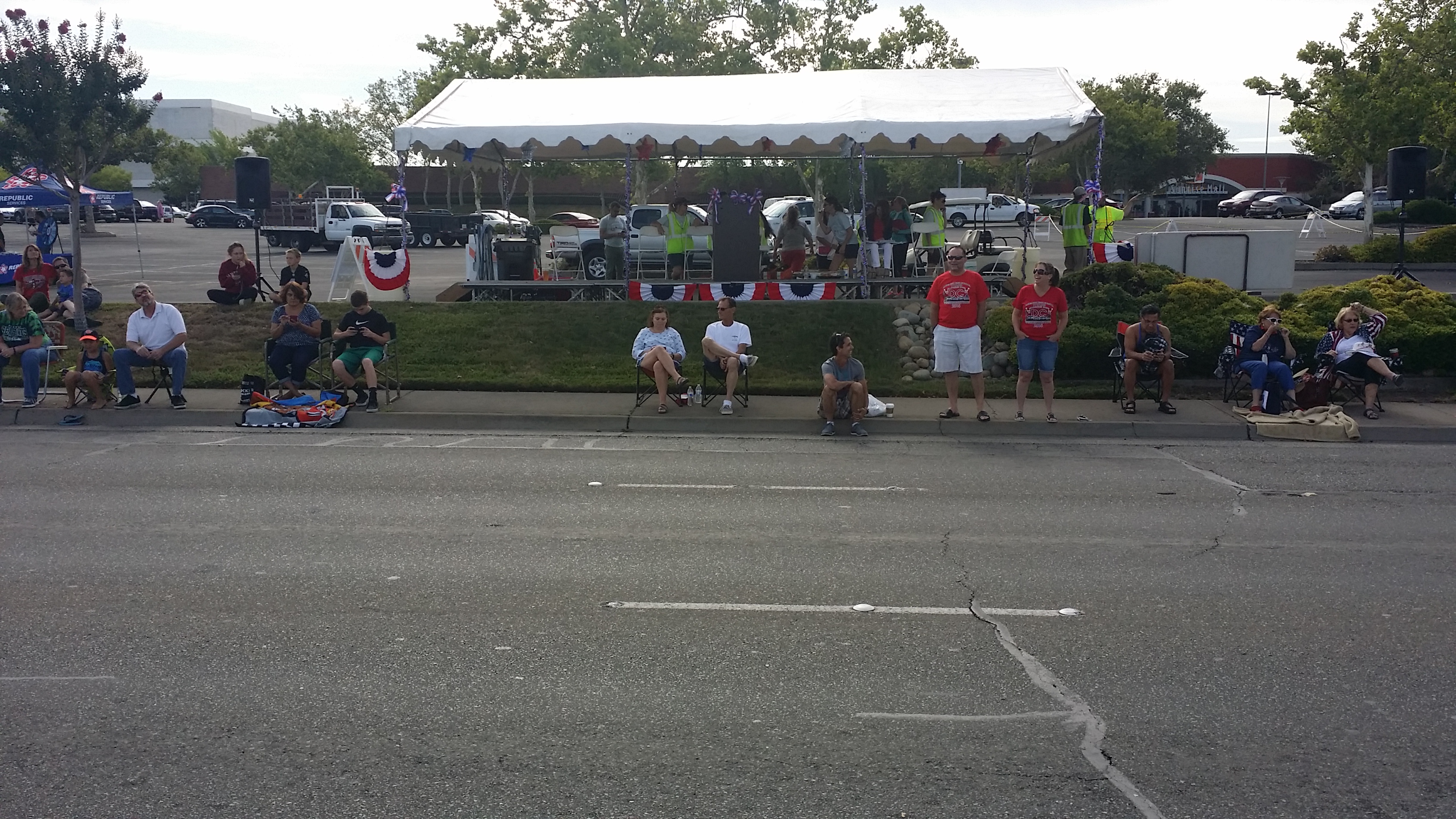 Neighbors gather at the parade grandstand