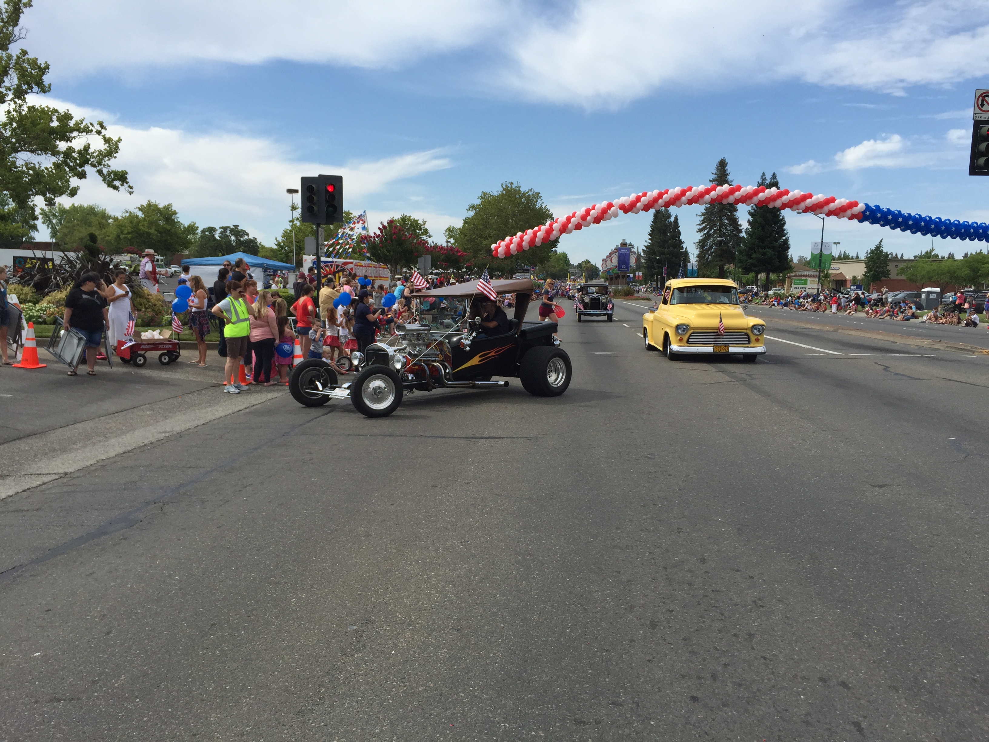An antique roadster and a 50s pickup truck
