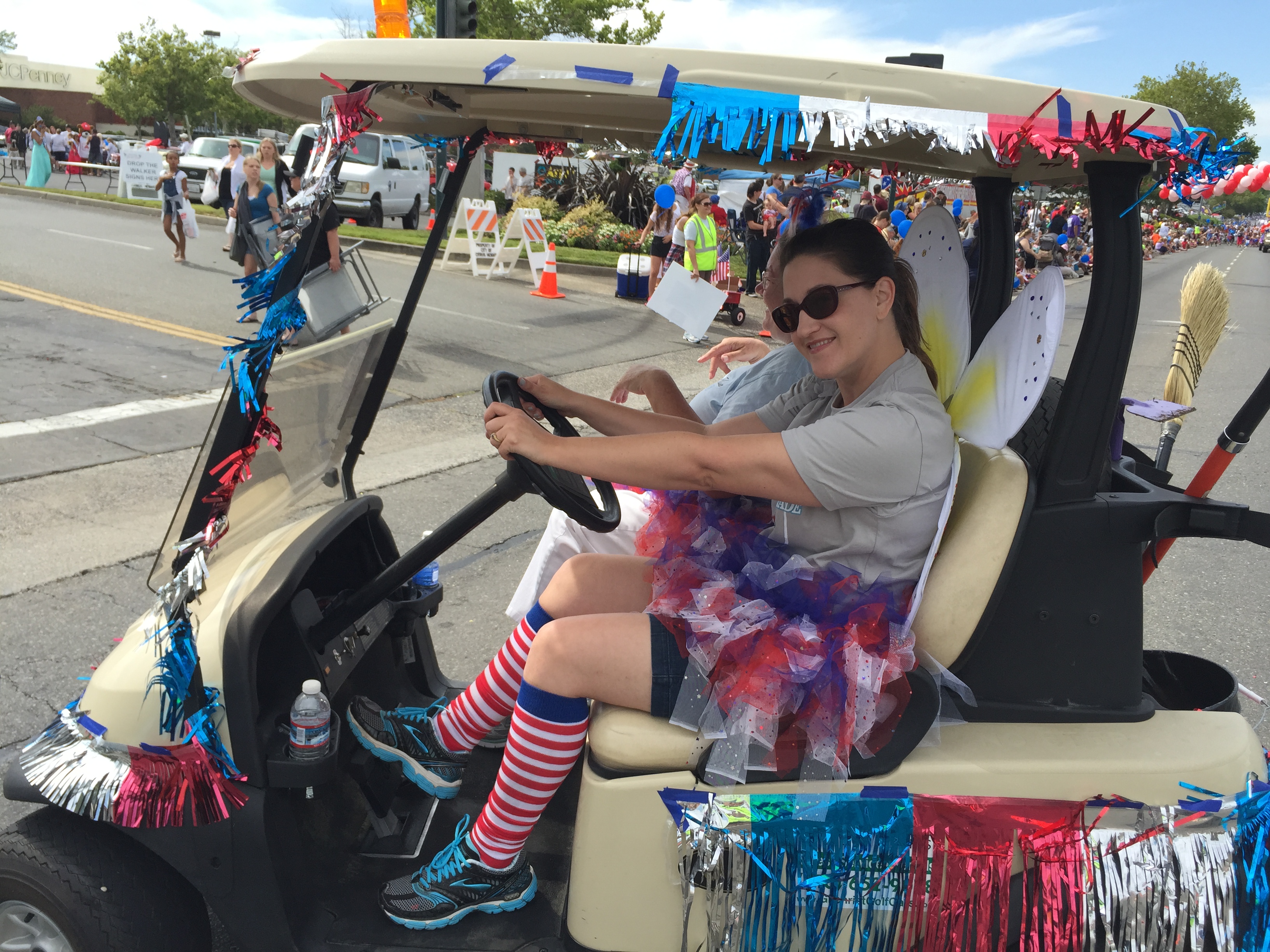 A volunteer having fun driving a golf cart