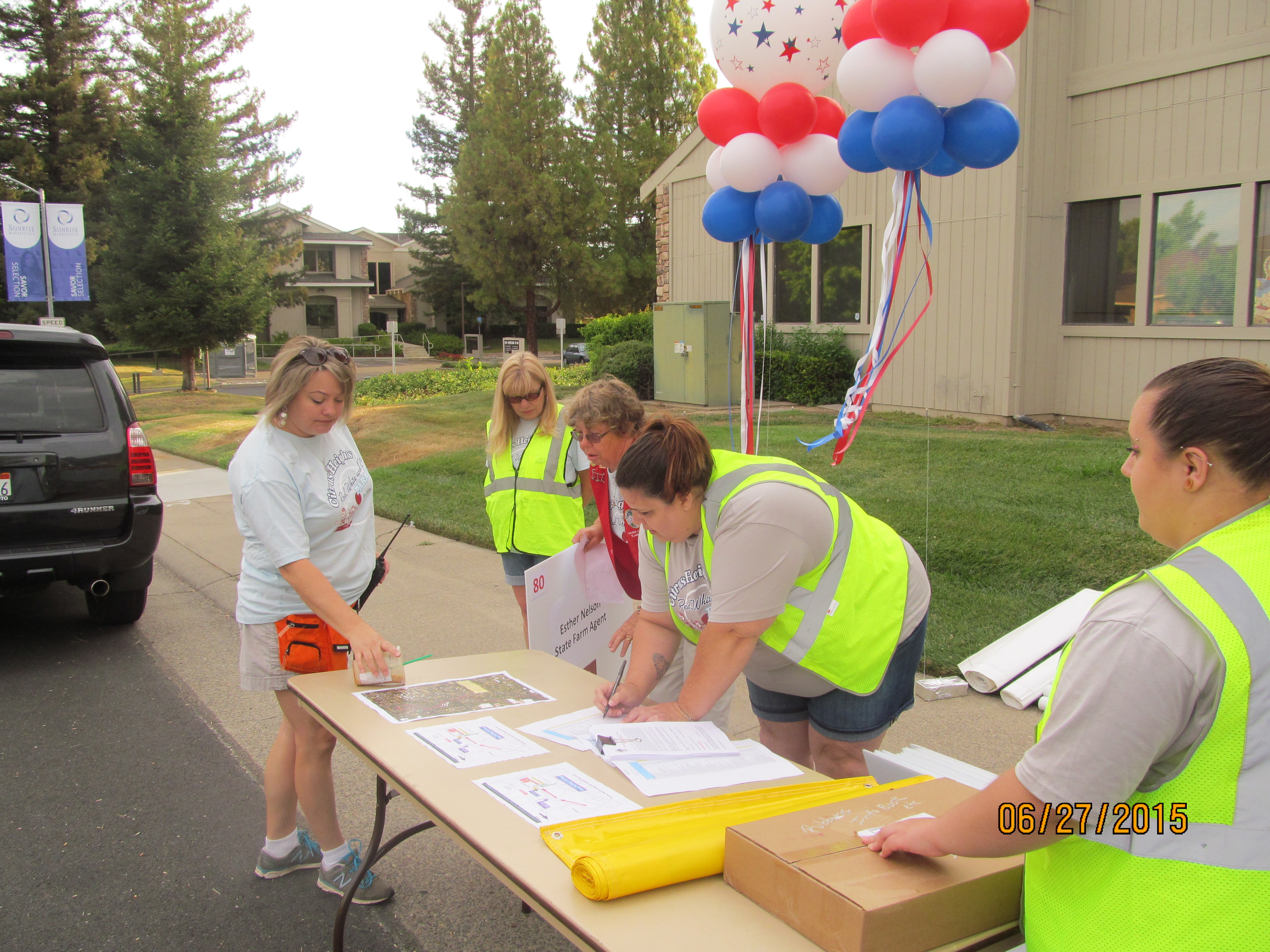 Volunteers checking in parade participants