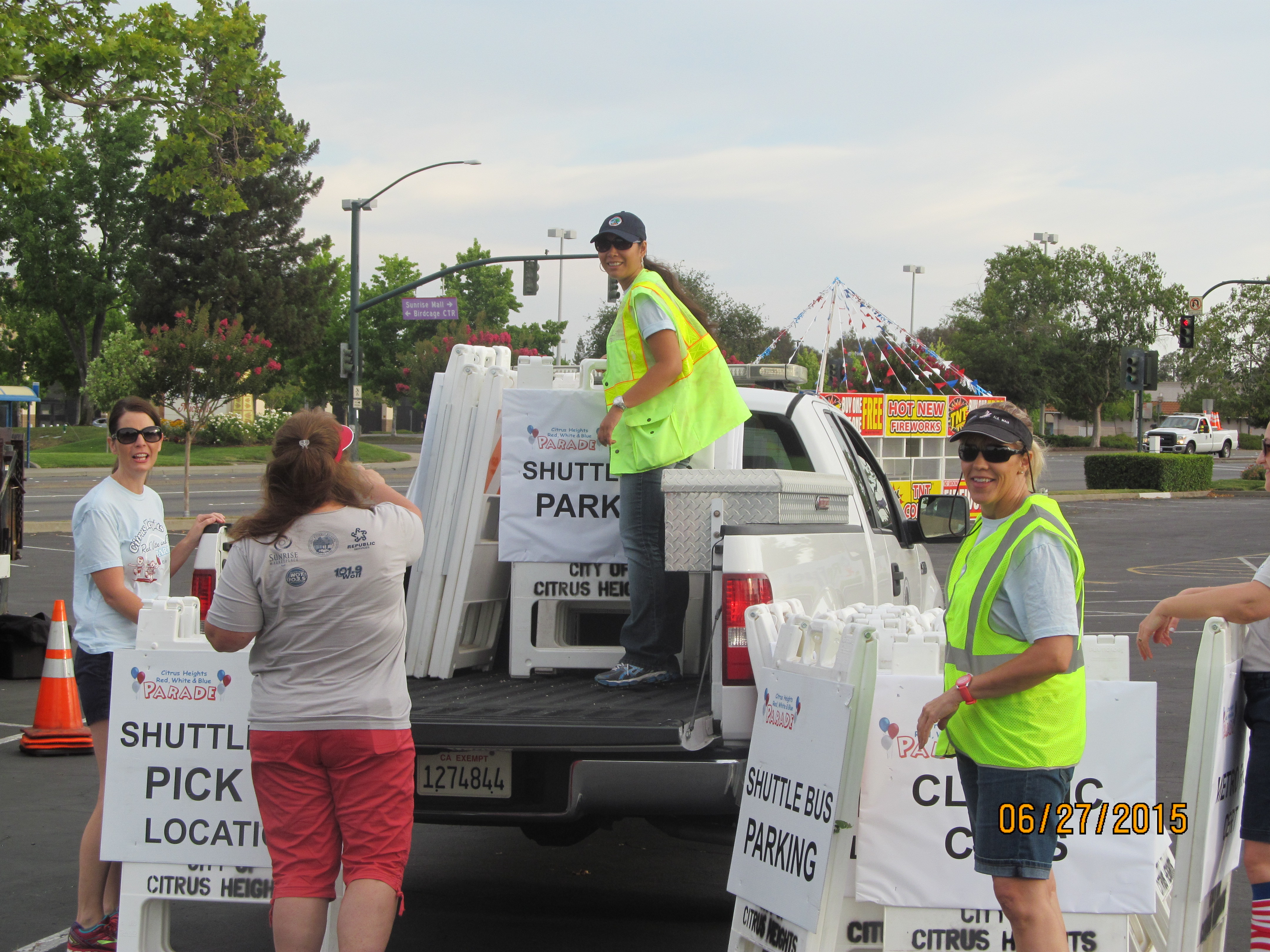 Volunteers setting parade signage
